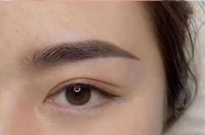 Before and After eyebrow embroidery services for Left eye increase in thickness and length chinese woman