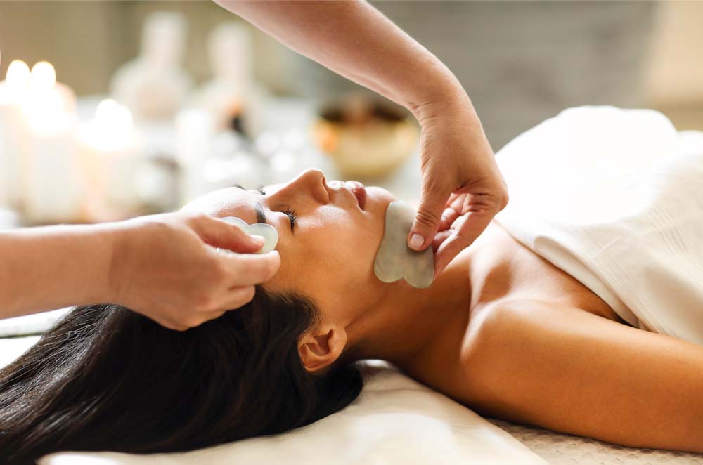 An asian lady getting a Meridian Bojin Facial Treatment in Singapore Spa
