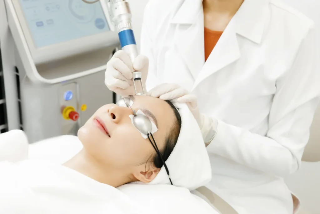 a woman having a laser facial treatment